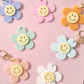 Acrylic Daisy Key Rings with trolley token option